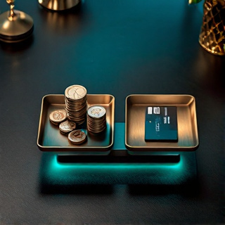 Balance scales holding coins on one side and payment cards on the other, evenly balanced